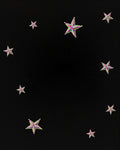 Sparkling Multicolor Star Scatter Across Black Rug