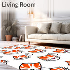 Playful Orange Tabby Kitten Faces Rug
